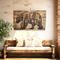 This is a large wood wall hanging featuring a bear and a forest scene. The rustic wall decor is hanging in an entryway over a bench. 